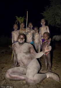 One of the Bodi tribe's fat men with his family