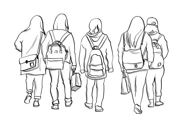 International students walking to college carrying their backpacks