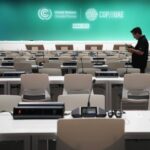 A worker sets up ahead of the COP28 U.N. Climate Summit 768x511 1