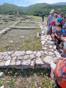 students guide peers in mycaenean settlement