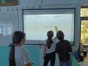 students in leontio play wordsearch game on interactive board