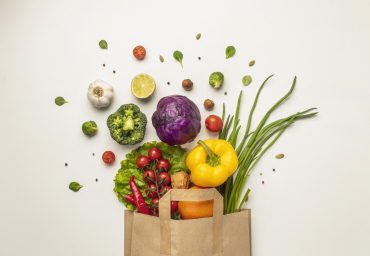 top-view-assortment-vegetables-paper-bag