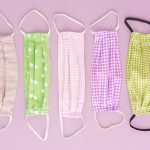 Colorful DIY corona covid19 fabric face mask on pink background