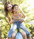 8198910 Mother And Son Riding On See Saw In Playground Stock Photo playground mom children
