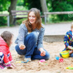 mother two little children playing together playground happy summer 41294944