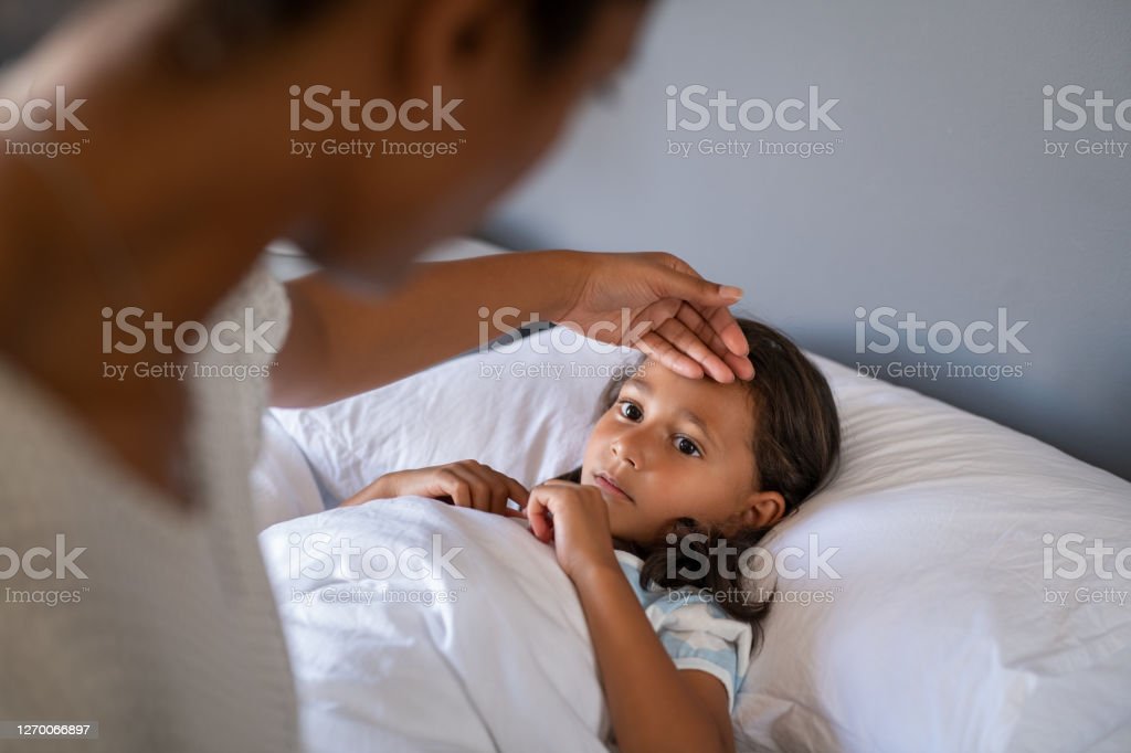 mom taking care of sick child